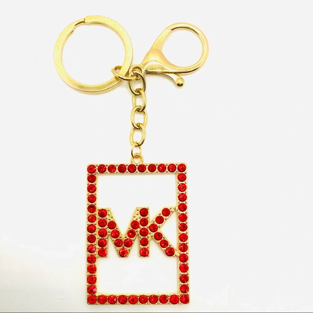 Purse Charm Key Chain MK in Red Crystals set in golden tone.